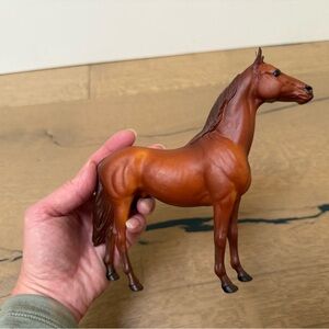 Smaller scale Breyer Man o' War horse. Approx 6 inches long.